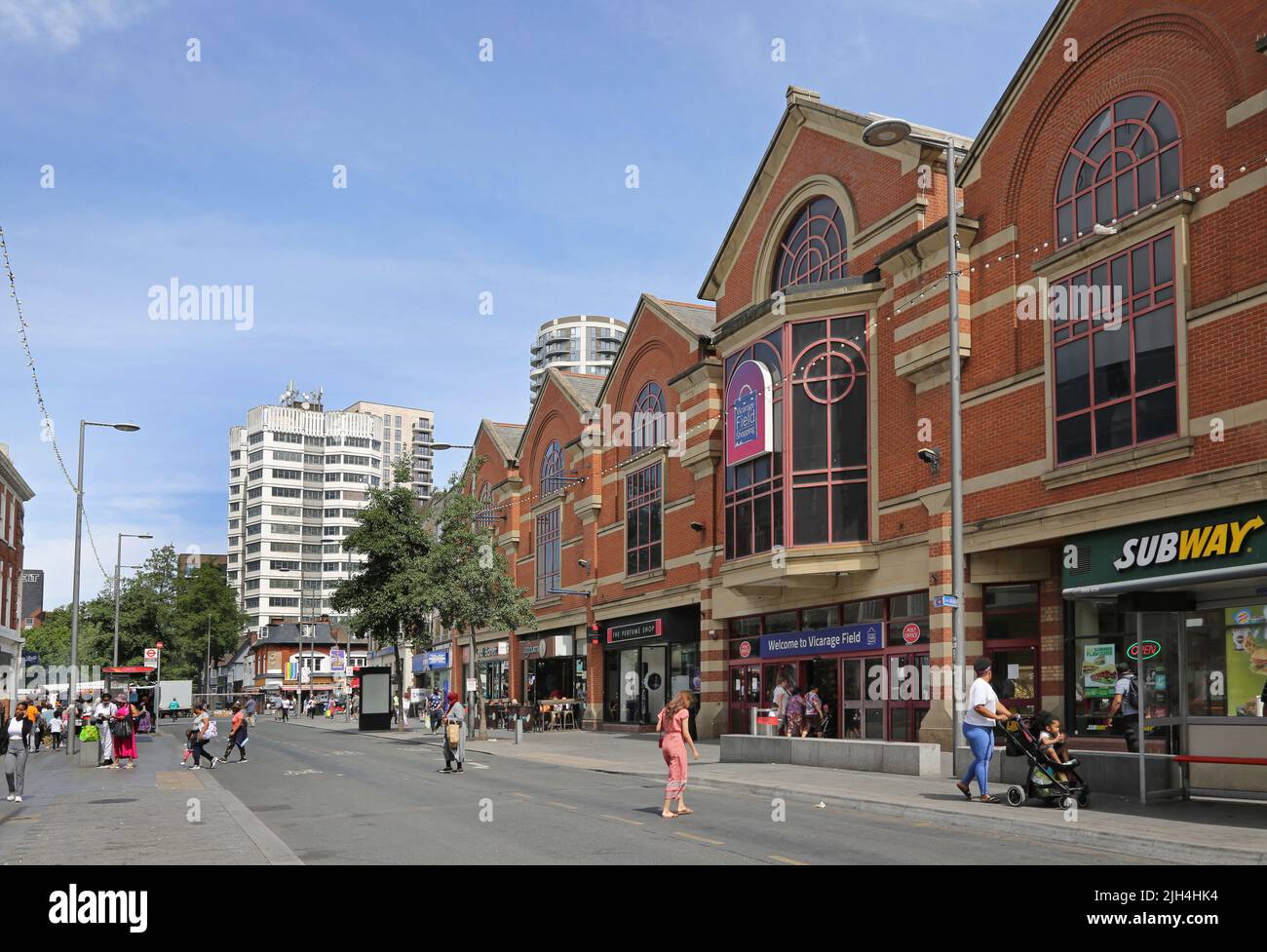 Barking town centre, London, UK. Ripple Road, shows Vicarage Field Shopping Centre (right). Busy, high Street environment. Summer day. Stock Photo