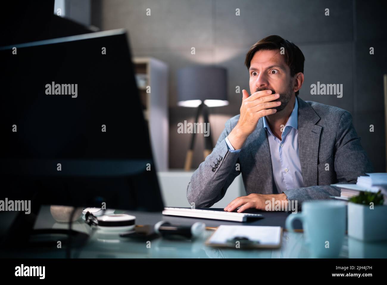 Business Person Confusion. Corporate Businessman Clerk Using Computer Stock Photo