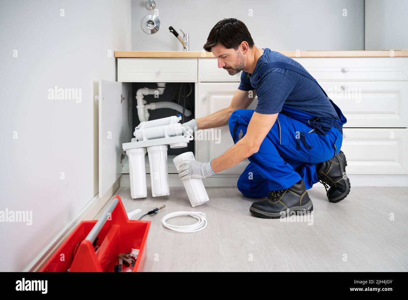 Water Purification Filter Install And Maintenance Service Stock Photo