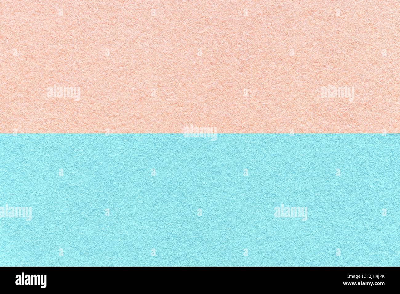 Texture of craft light blue and pink paper background, half two colors ...
