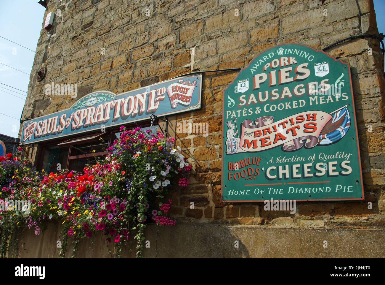 Colourful signage on the frontage of Sauls of Spratton, a well known butchers shop in the village of Spratton, Northamptonshire, UK Stock Photo