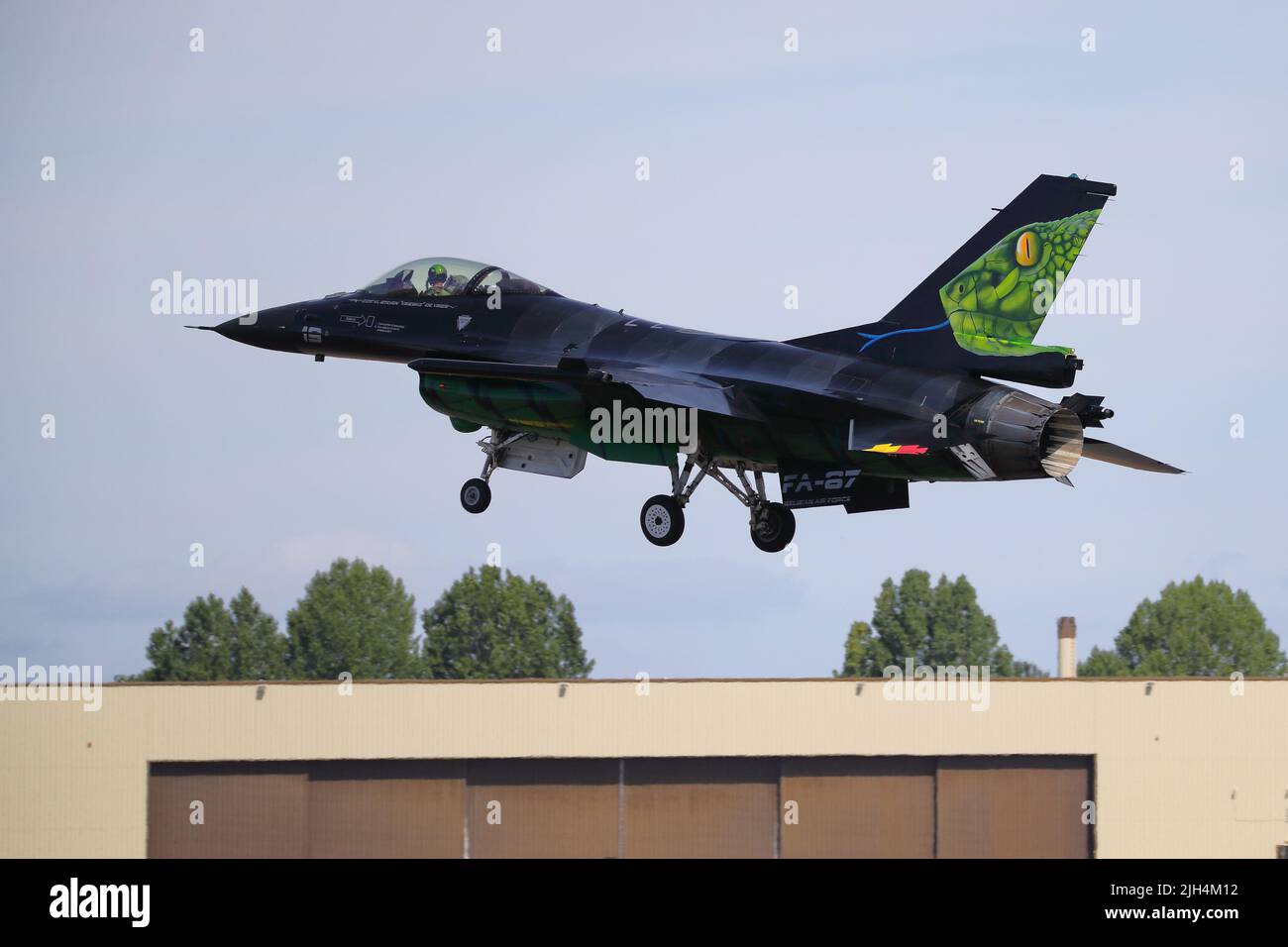 Fairford, UK, 14th July 2022,  A Belgian General Dynamics F-16 displaying a snake's head on its tail fin arrives for the RIAT Royal International Air Tattoo, which will be held from Friday, 15th to Sunday 17th of July. Stock Photo