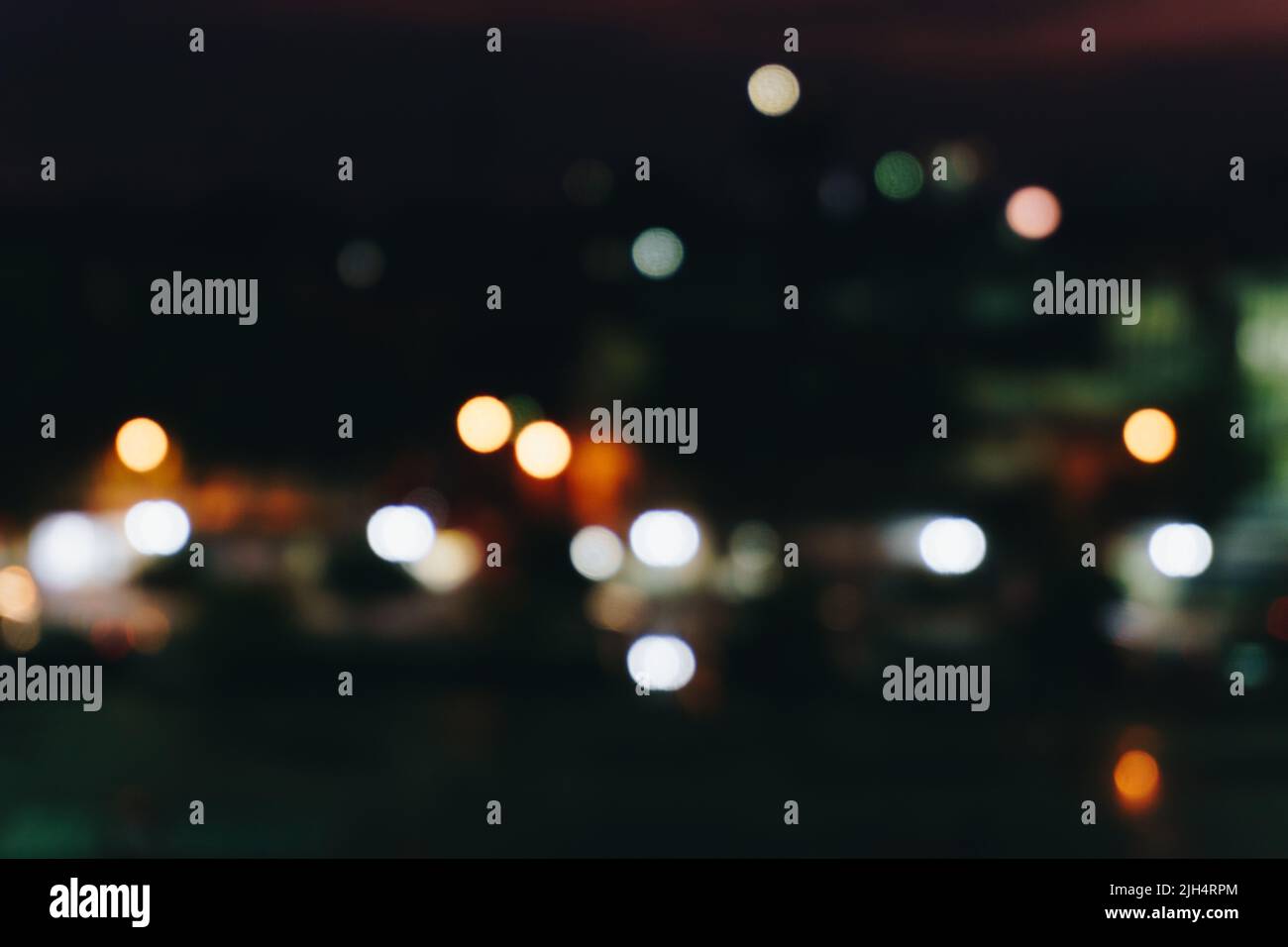 Abstract blurred bokeh city at night with sky and road light blurred ...