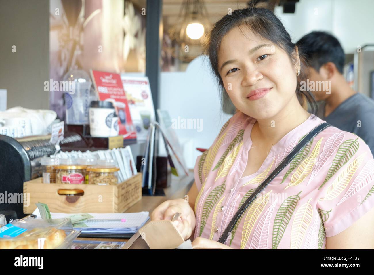 Young asian woman choosing sweet products at grocery supermarket ...