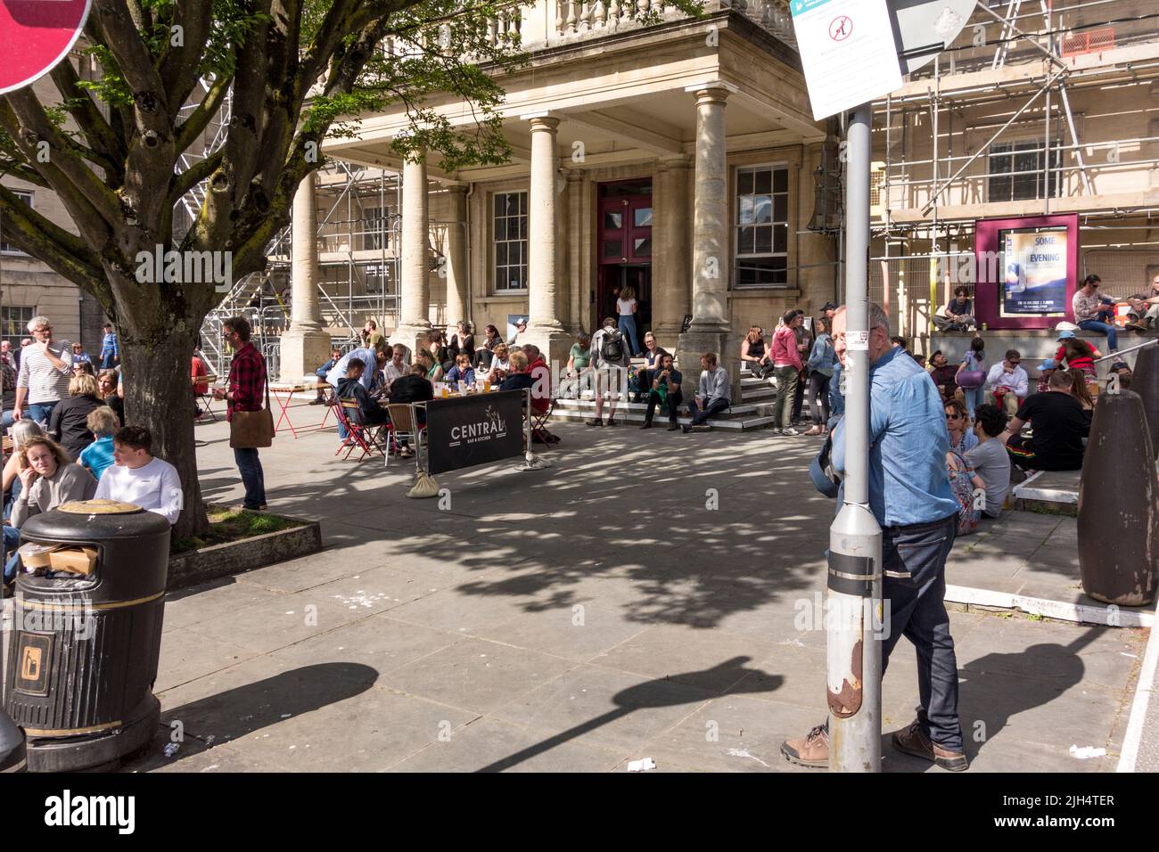 People enjoying sunny day in front of the Subscription Rooms, Stroud, Gloucestershire, UK Stock Photo