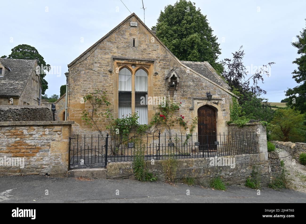 The Old School House, a traditional stone built house in the Gloucestershire village of Upper Slaughter Stock Photo