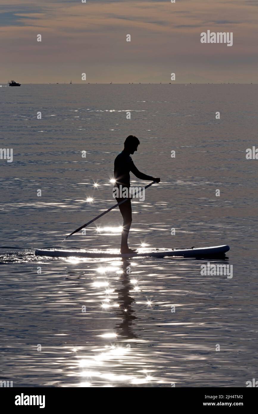 Practice of Stand Up Paddle in the Mediterranean. Carnon, Occitanie, France Stock Photo