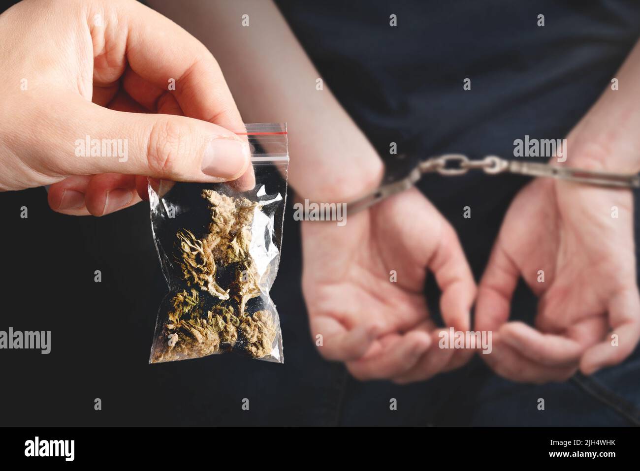 Criminal handcuffed, back view. Criminal arrested, security concept Stock Photo
