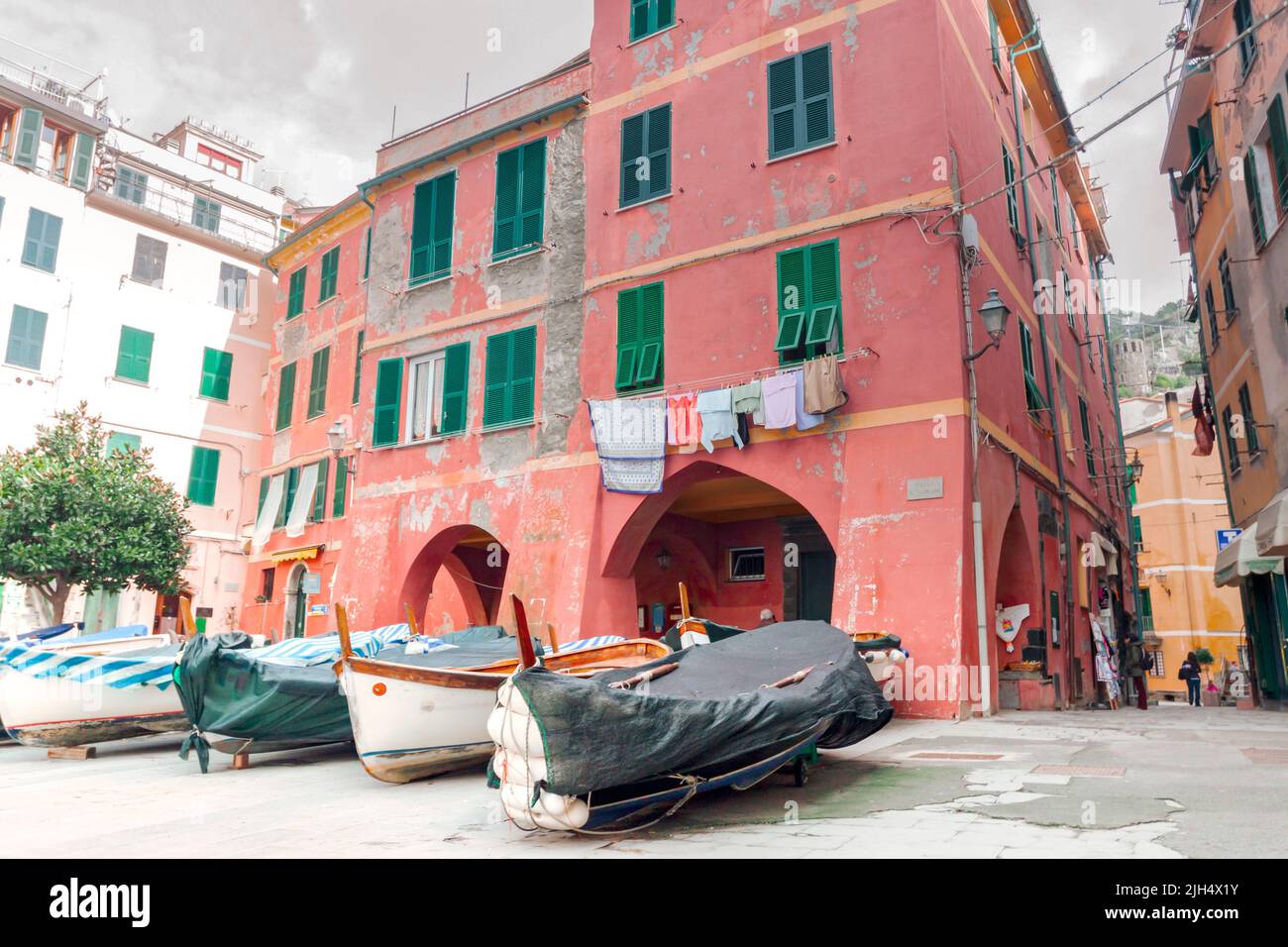 Characteristic houses and boats on ligurian coast named five lands in winter time. Vernazza, Liguria. Italy Stock Photo
