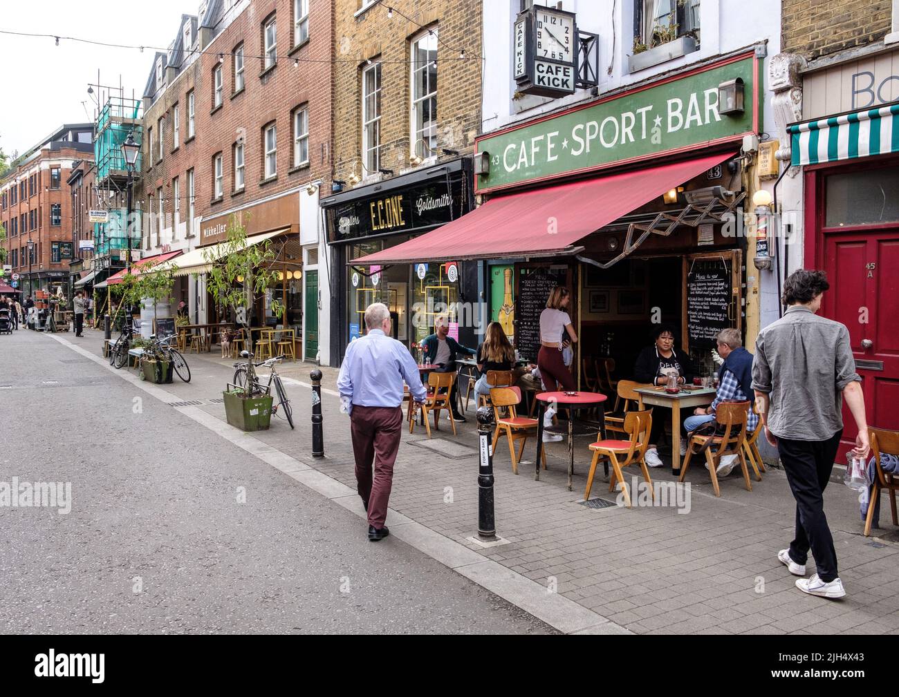 Street scene - Exmouth Market, Clerkenwell, London - main focus is Cafe Kick Stock Photo
