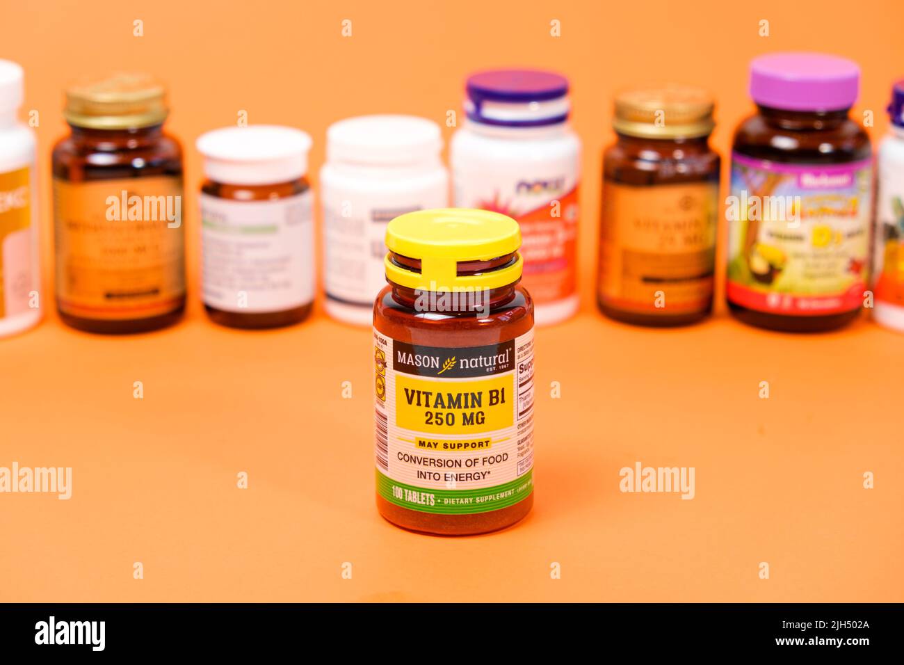 Vitamin B1 and other dietary supplements on an orange background. 19 May 2022, Ukraine, Zaporozhye Stock Photo