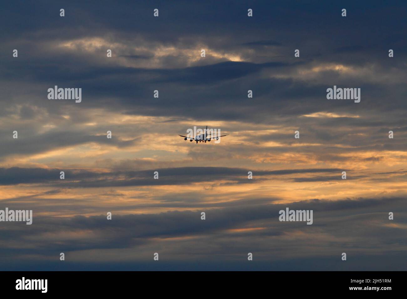 Boeing 747 on the flightpath for East Midlands Airport. Sunset. Stock Photo
