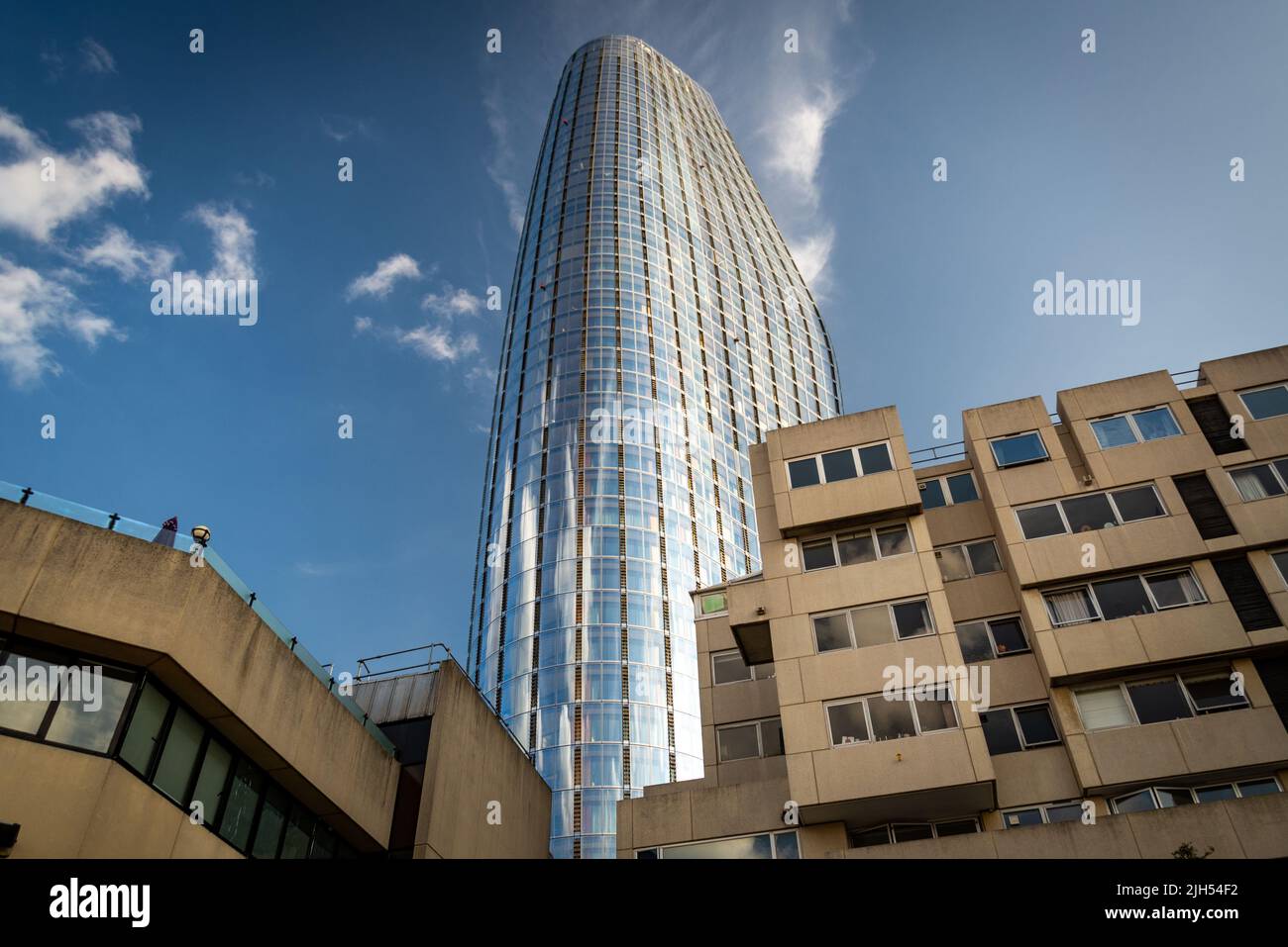 Pointing into blue skies above, on a hot summer day,the tall modern ...