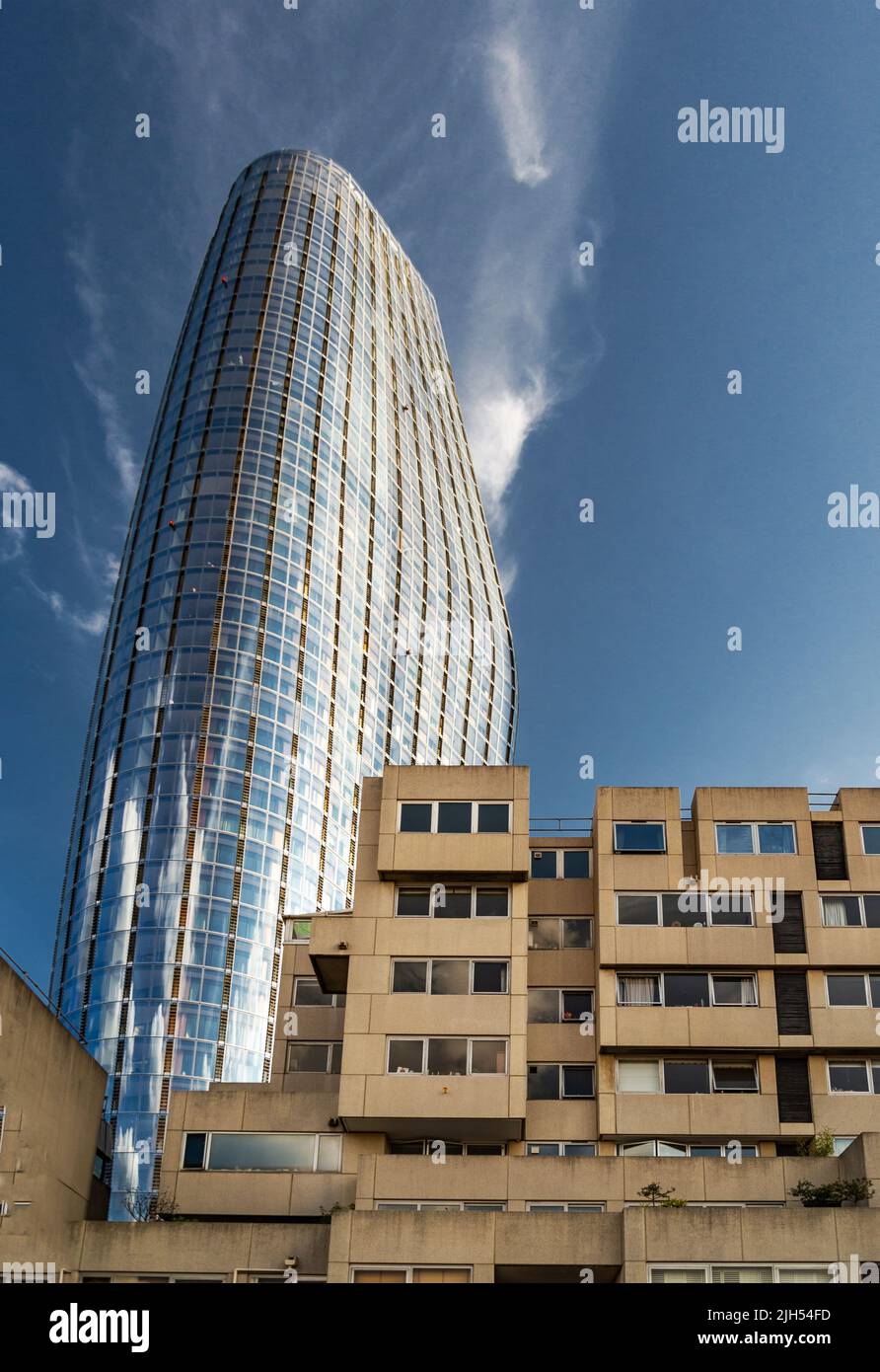 Pointing into blue skies above, on a hot summer day,the tall modern ...