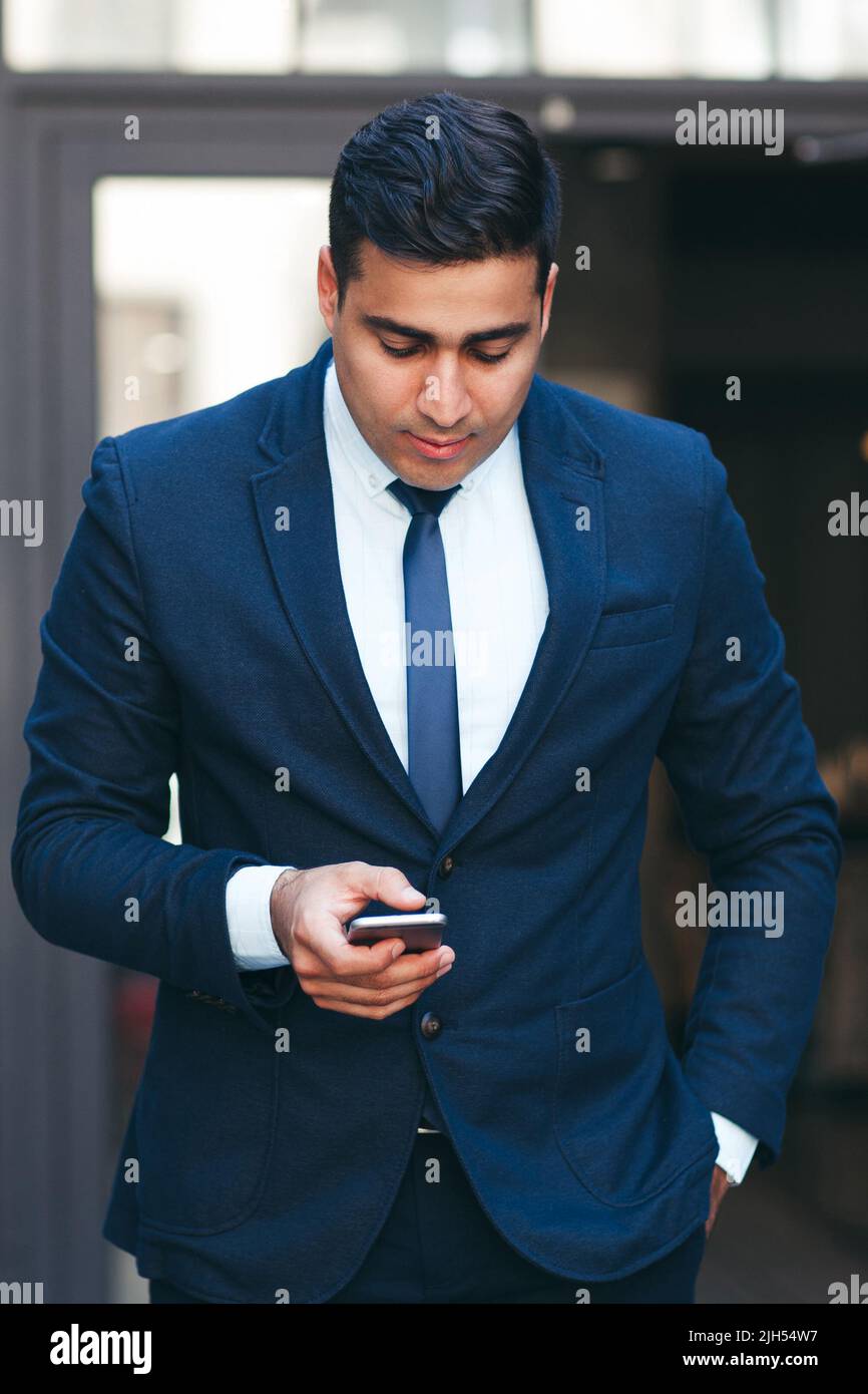 Neat young wealthy busy businessman Stock Photo