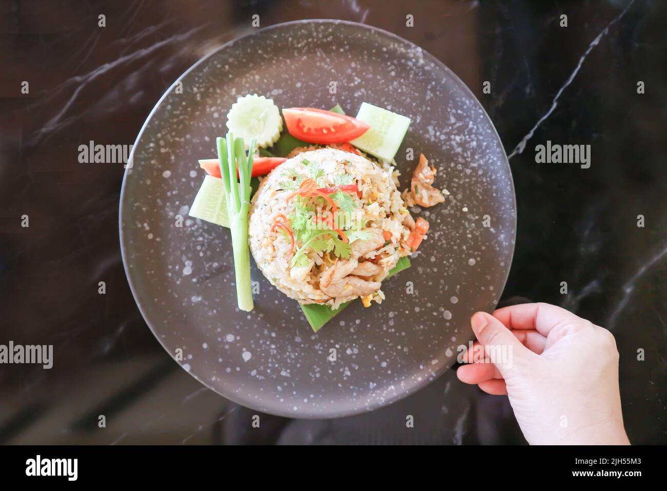 stir fried rice or fried rice with fried pork topping , pork and rice