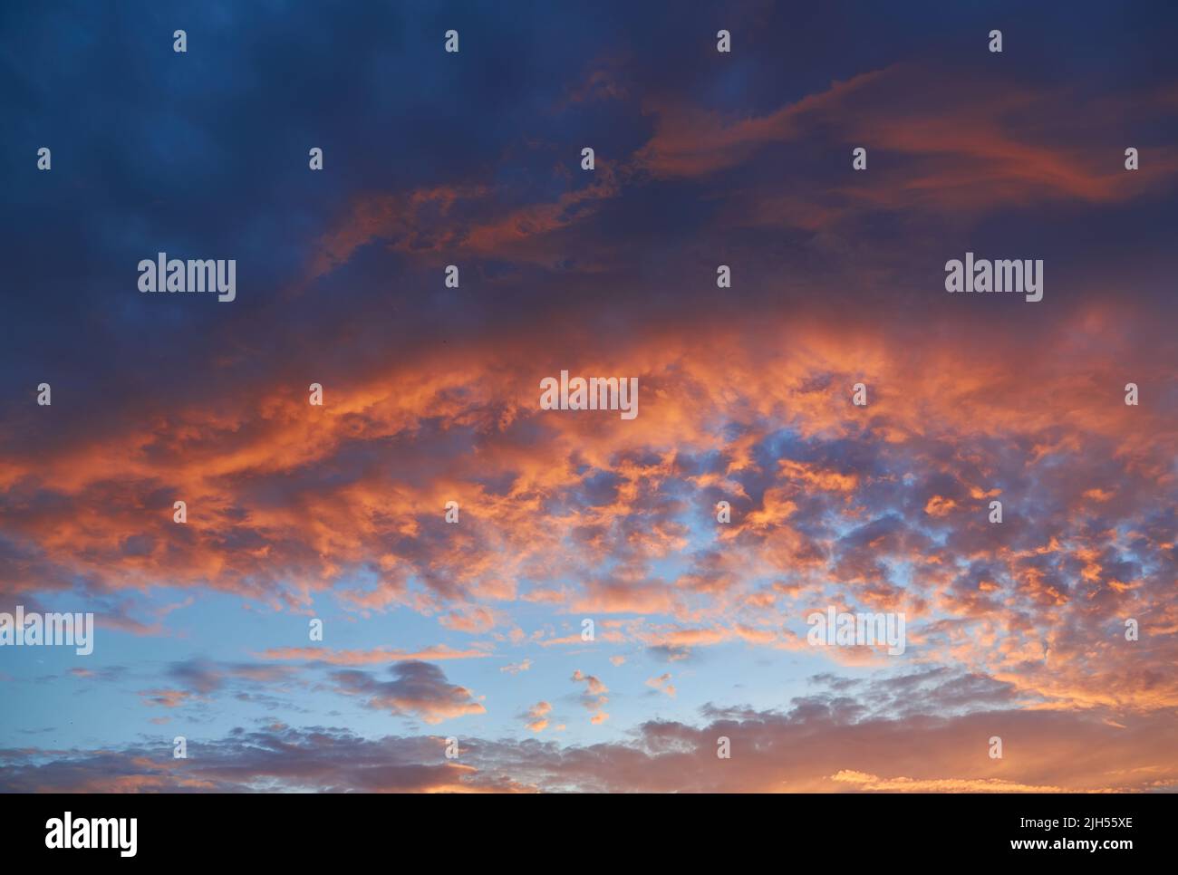 Cloudscape of cumulus sunset clouds with sunlight Stock Photo - Alamy