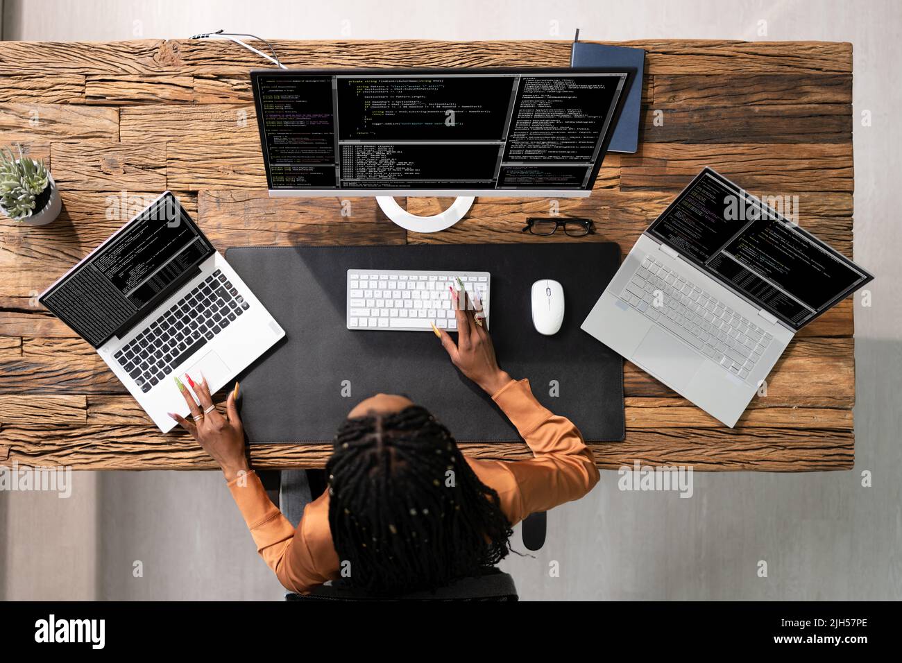 African American Programmer Woman Coding On Computer Stock Photo