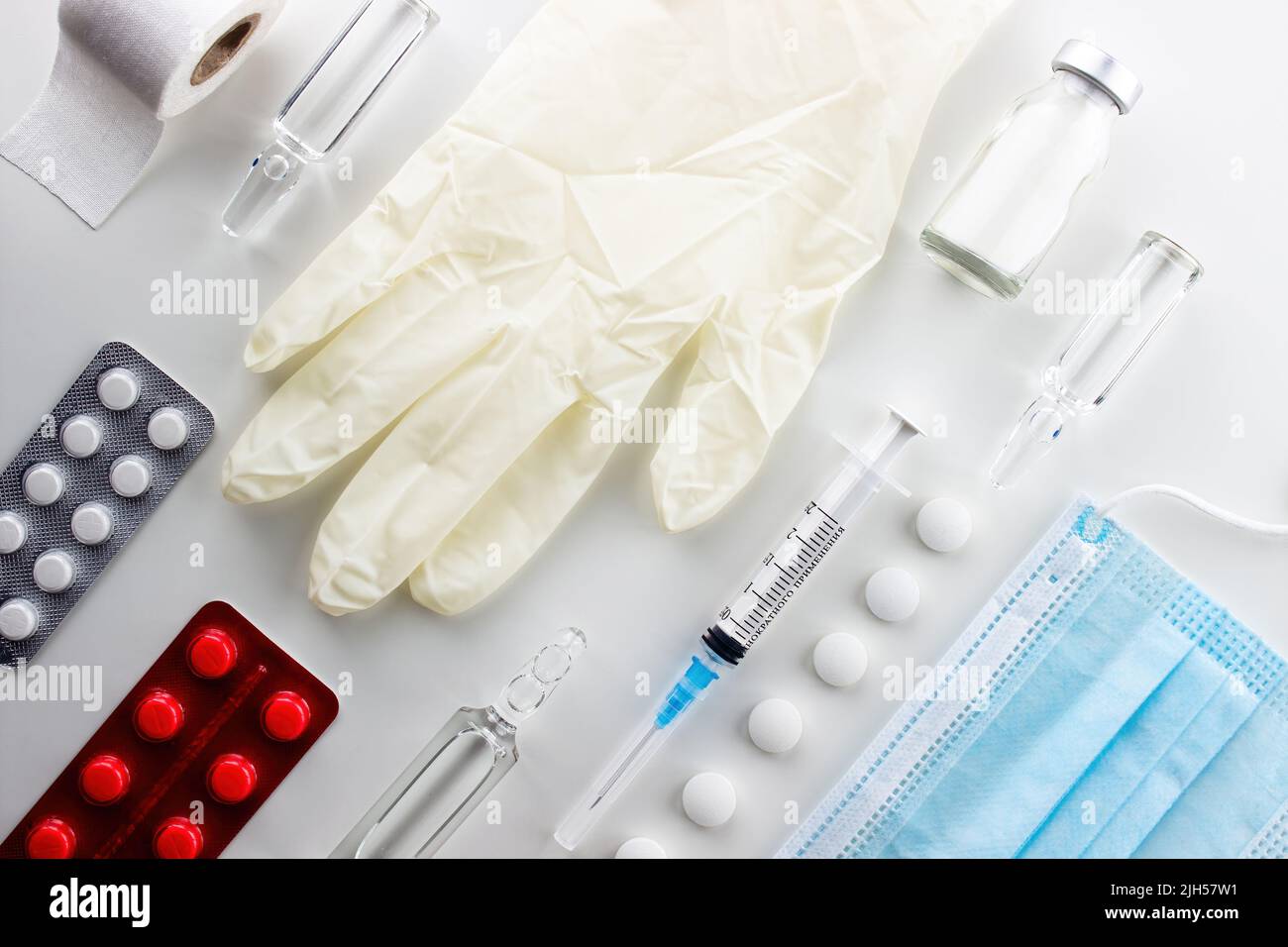 Various medical equipment, ampoules, drugs, tablets, capsules, spray, patch, syringe, vials on a white background. Medicine, pharmacy, hospital, treat Stock Photo