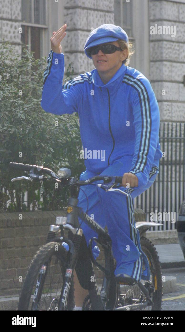 **EXCLUSIVE**PICTURES**TRUE**BLUE** Madonna arrives at the Jewish Kabbalah centre she has purchased in London this morning. The star who arrived on her bike wearing a bright blue tracksuit arrived around 30mins after Movie Director husband Guy Ritchie. Madonna has become Kabbalah's most famous proponent since crediting it with helping her make the album Ray of Light. 'I think Kabbalah is very punk rock,' she said. 'It teaches you that you are responsible for everything. Stock Photo