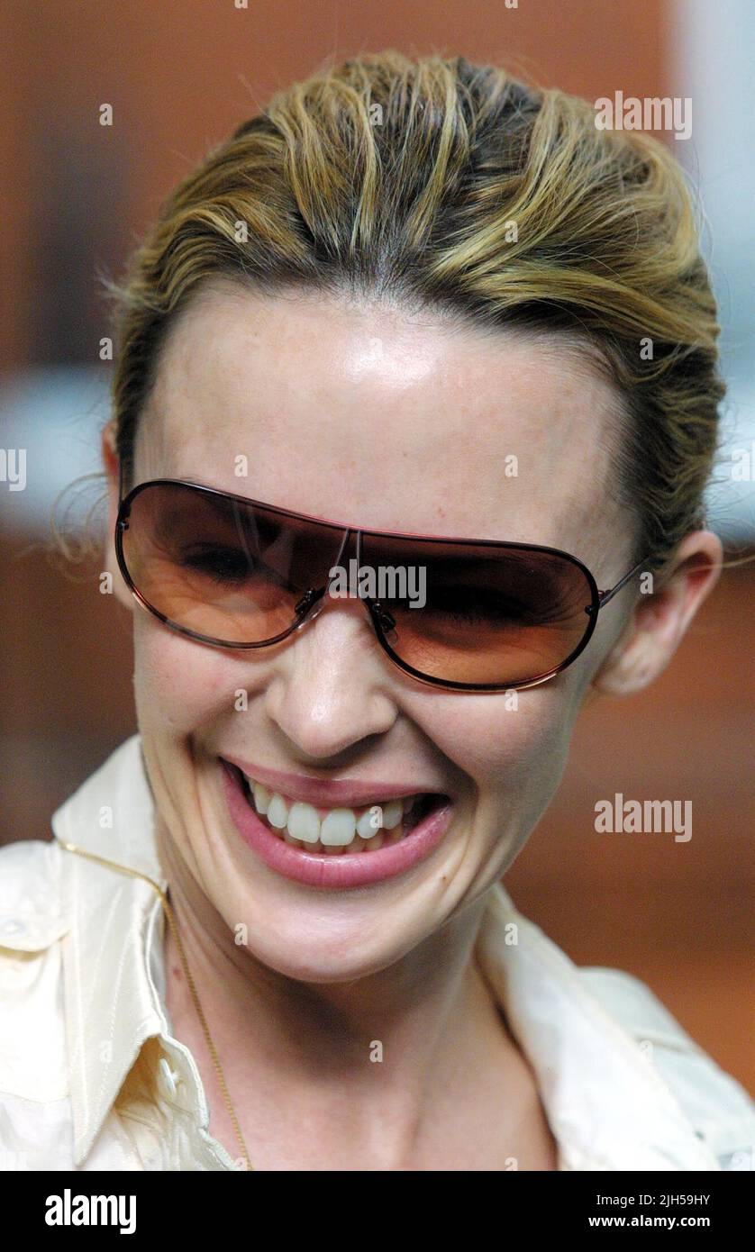 A beaming KYLIE MINOGUE poses up for pictures outside her London home this evening; stating that she does not understand the interest in her private life and that she is fine . Photo by Tony Henshaw Stock Photo