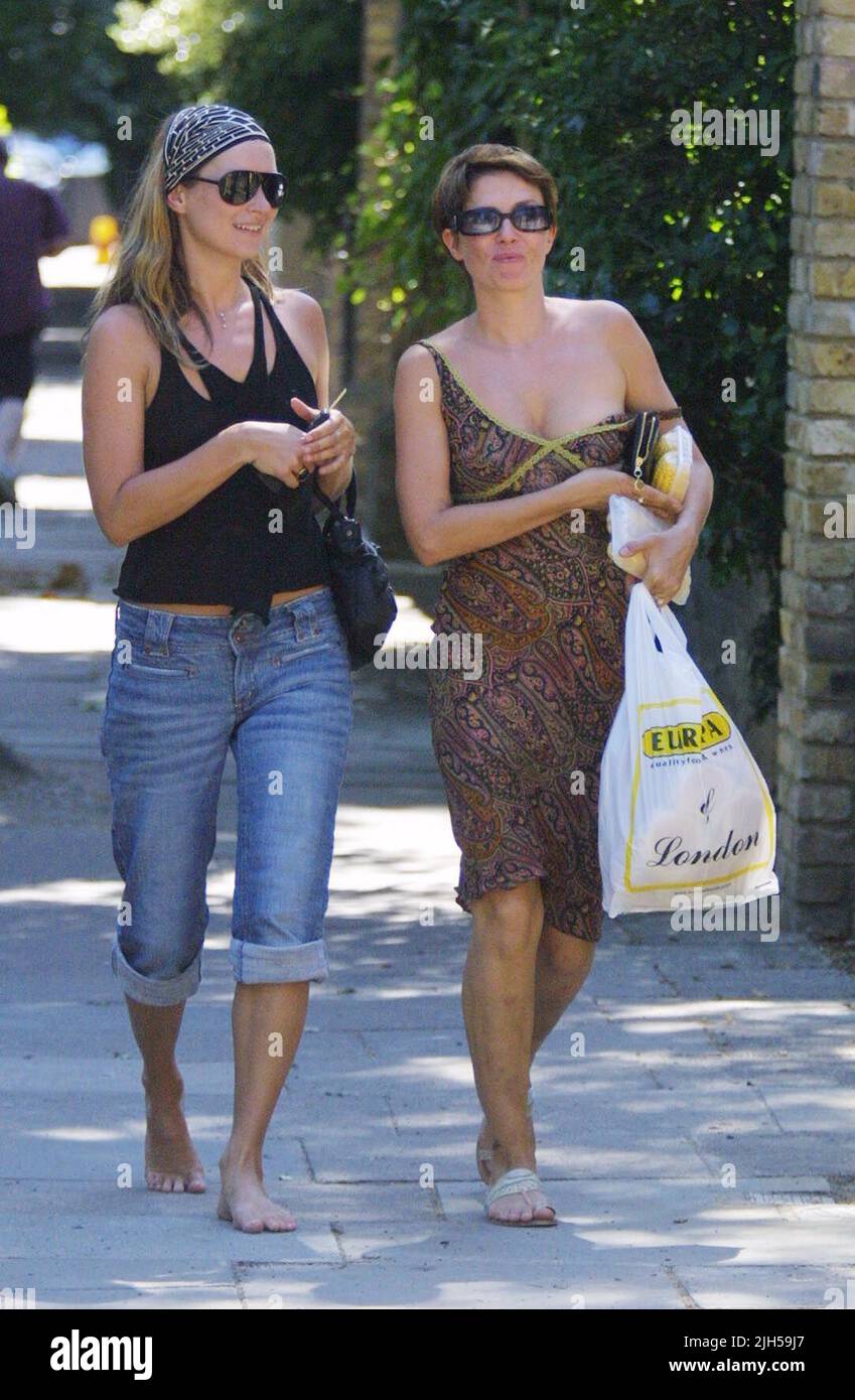 Exclusive! KATE'S PLATES! Celebrity pals Kate Moss and Sadie Frost seen outside Sadie's house in North London. They nipped out to buy some snacks but forgot their keys to get back in! Luckily, a friend arrived to the rescue in her bikini at the front door. Kate looked like she was in the mood for fine summer weather by going out barefoot! The couple were also joined later by close friend Marianne Faithfull. Photo by Tony Henshaw Stock Photo