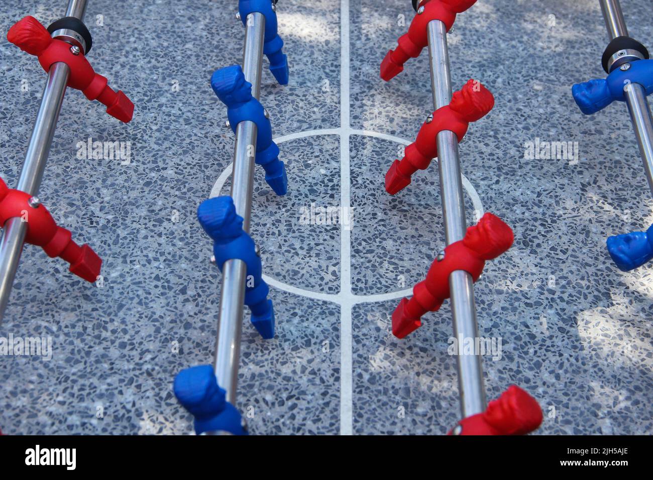 Table football game. Foosball table made of granite. Competitive spirit ...