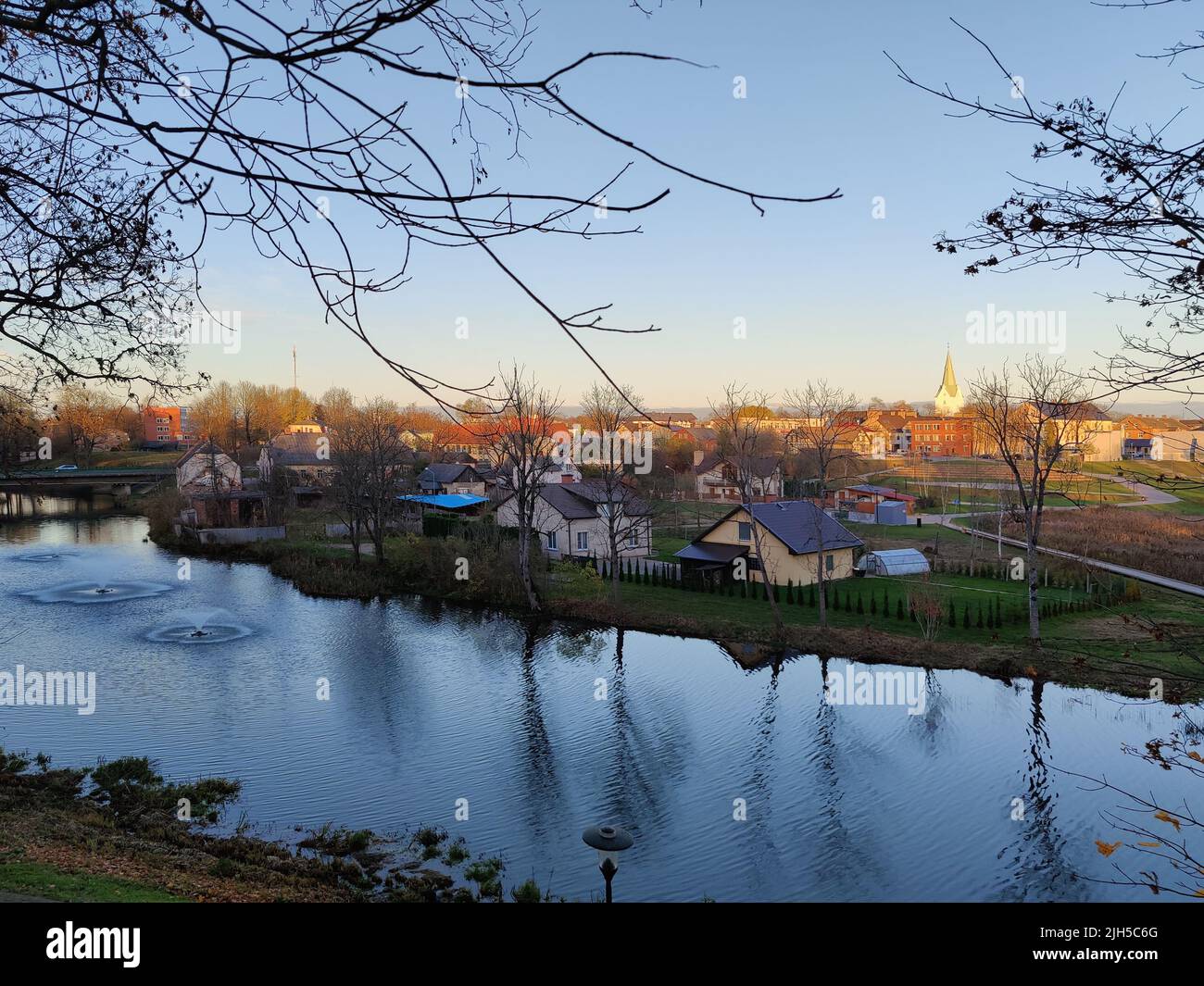 Quiet neighborhood with private houses. Private residential sector near the river. European living. Stock Photo