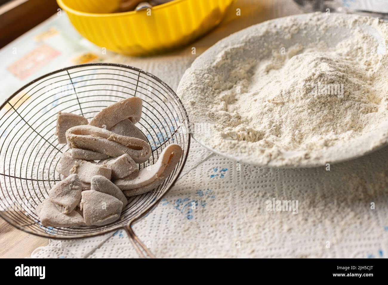 Fish breading for frying, food preparation home made. Breading of fish