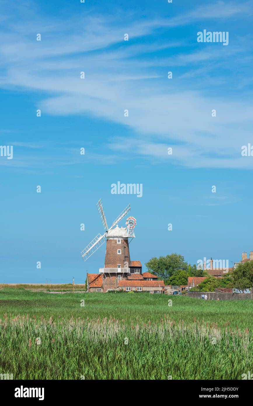 Windmill Cley Norfolk, view in summer across Cley Marshes towards the 18th Century windmill in Cley next the Sea, North Norfolk coast, England, UK Stock Photo