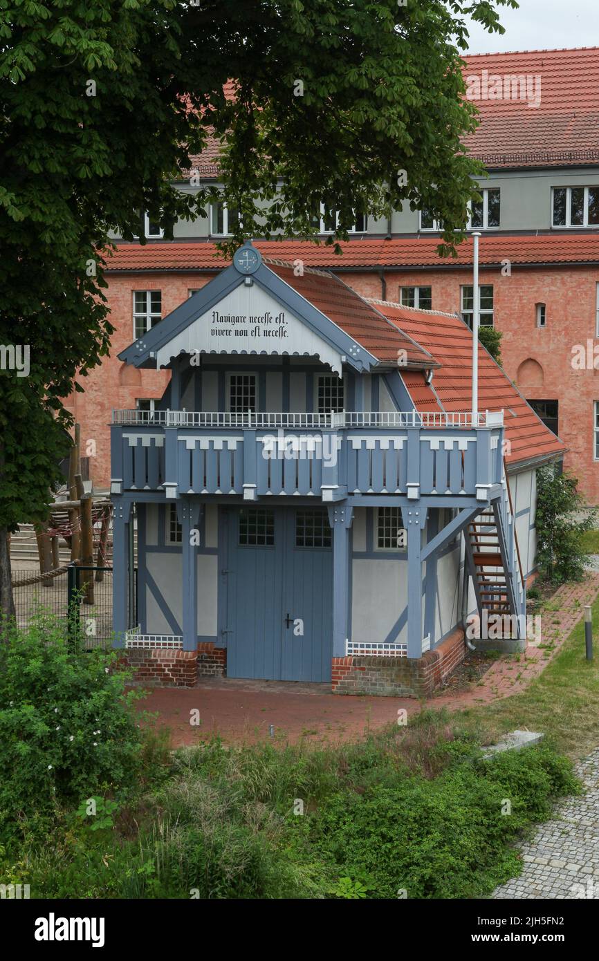 Cute wooden house on the schoolyard in Brandenburg an der Havel Stock Photo