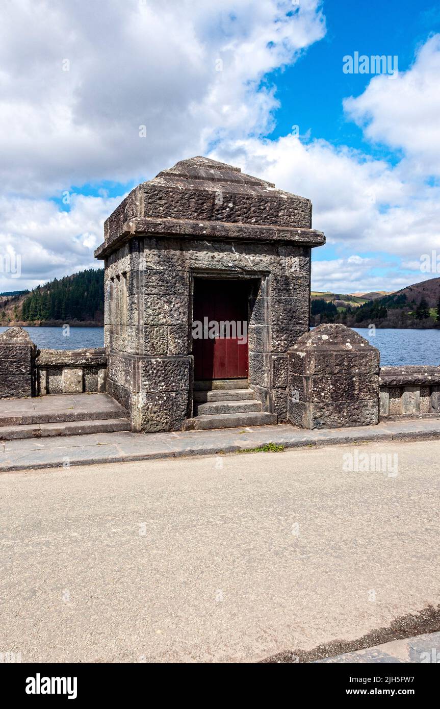 A stone tower on top of Lake Vyrnwy Dam which houses the valves that control the flow of excess water from the dam to allow the river to flow normally Stock Photo