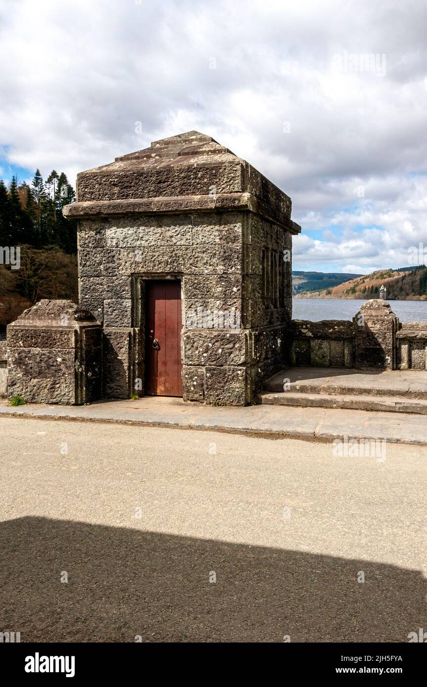 A stone tower on top of Lake Vyrnwy Dam which houses the valves that control the flow of excess water from the dam to allow the river to flow normally Stock Photo
