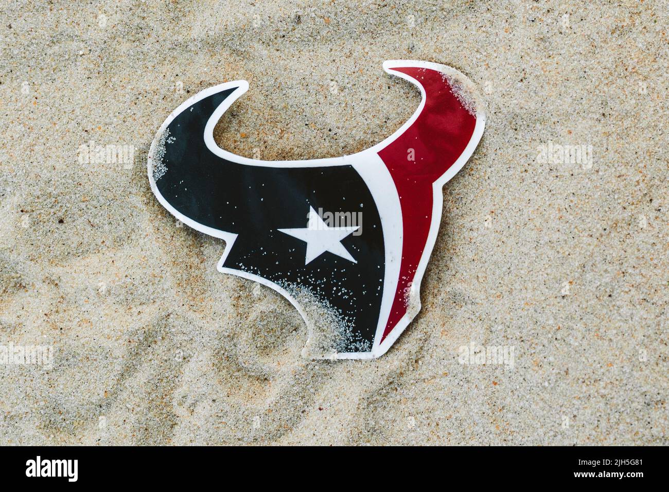 September 15, 2021, Moscow, Russia. The emblem of the Houston Texans football club on the sand of the beach. Stock Photo