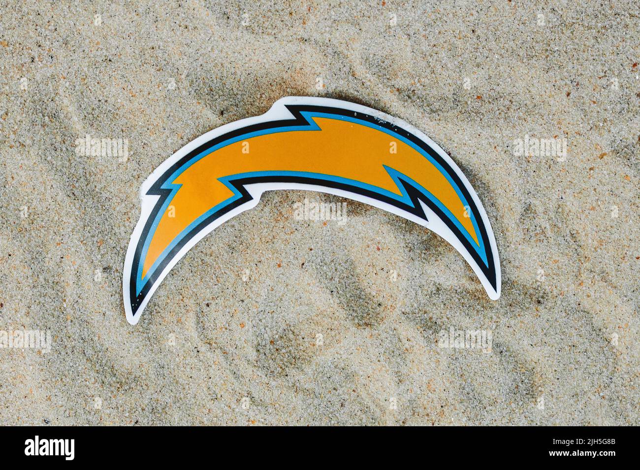 September 15, 2021, Moscow, Russia. The logo of the Los Angeles Chargers football club on the sand of the beach. Stock Photo