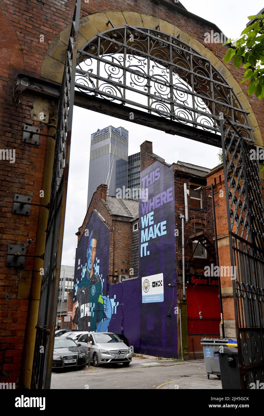 EDITORIAL USE ONLY A Cyber-Punk mural of Manchester City FC star Joao Cancelo by Akse P19 and Global Street Art Agency is unveiled in Manchester as crypto trading platform OKX celebrates becoming the Official Training Kit Partner of MCFC for the 2022/2023 season. Picture date: Friday July 15, 2022. Stock Photo