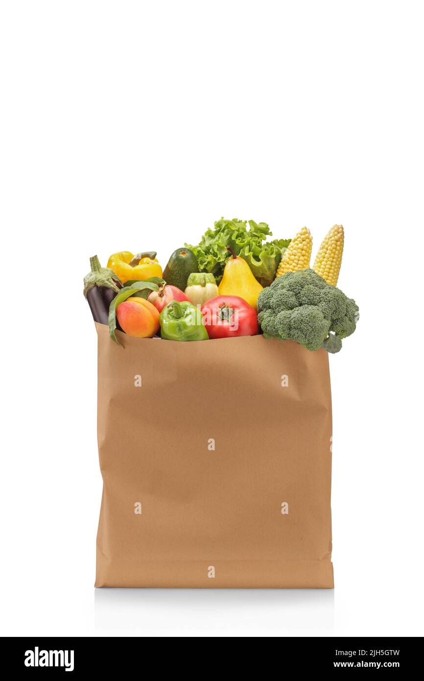 Studio shot of fresh fruits and vegetables in a paper bag isolated on ...