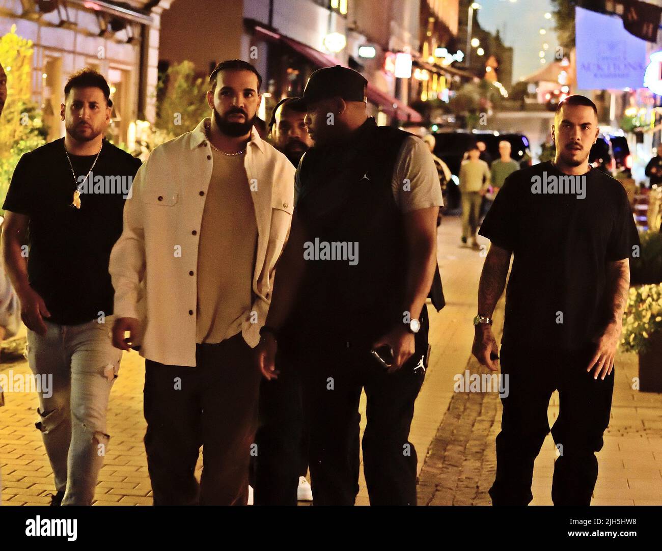 *CAPTION CORRECTION* Artist Drake with entourage on Biblioteksgatan, Stockholm, Sweden 13 July 2022 Photo: Lars Hoglund / TT / Code 2884  EXCLUSIVE Stock Photo