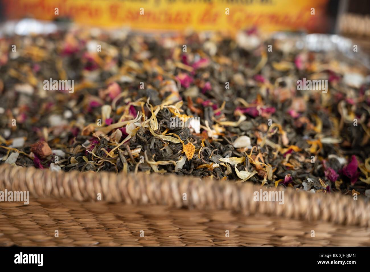 Blended black leaf dry tea with aromatic flowers, spices in tea shop in ...