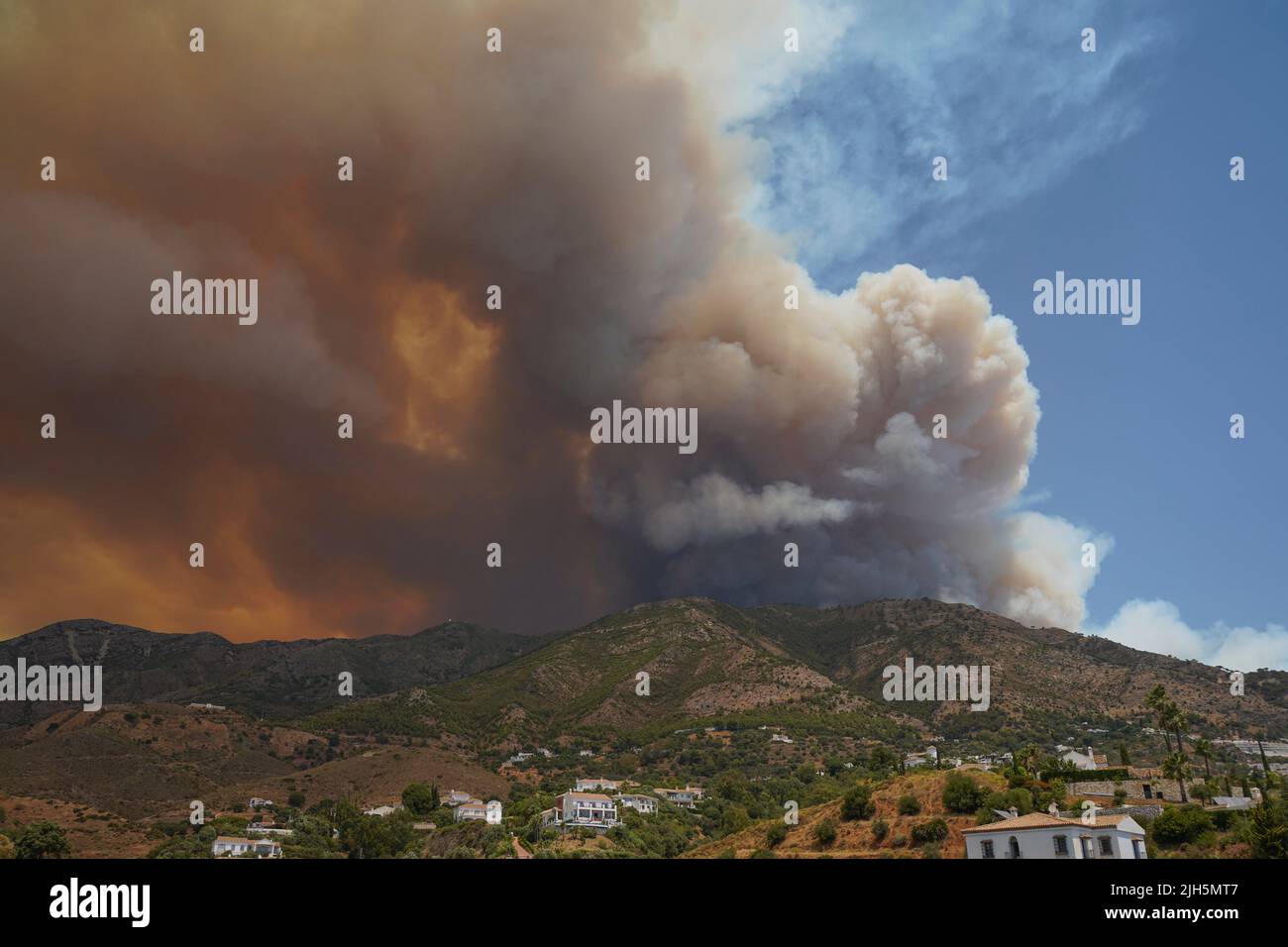 Wildfire in the Sierra de Mijas, huge smoke column can be seen during pine forest fire. 18 july 2022, Mijas, Andalucia, Spain. Stock Photo