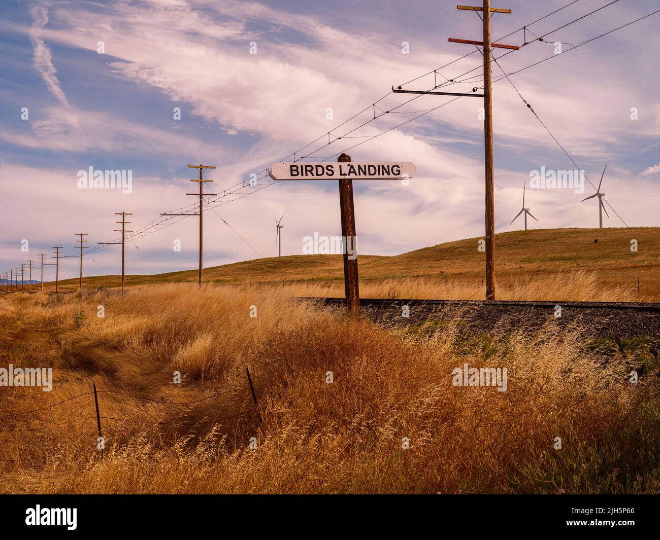 Birds Landing Signage, Solano County, California, with the shiloh wind turbines in the background Stock Photo