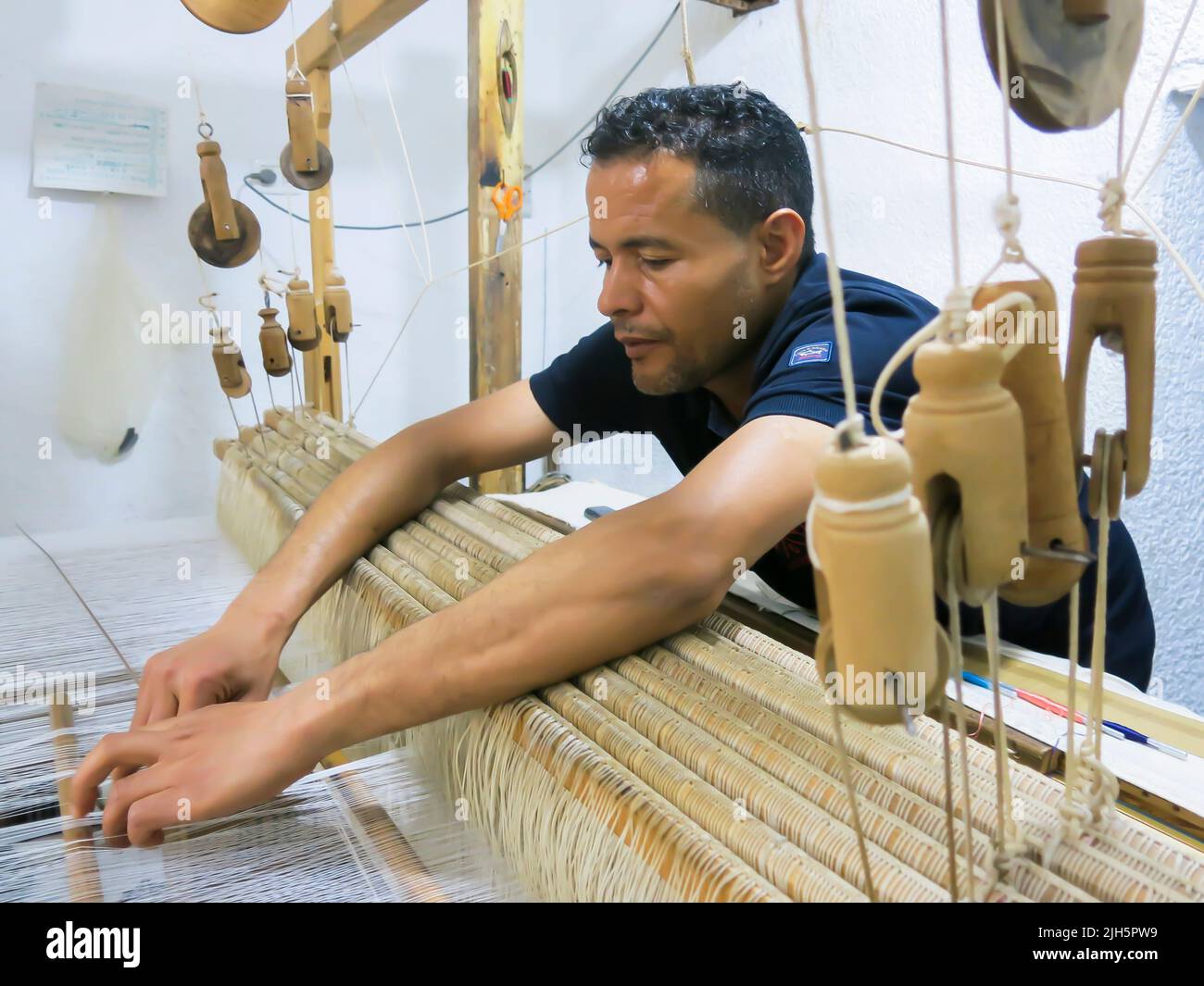 Demonstration - Weaving Cloth (Material) in Tunisia, North Africa Stock Photo