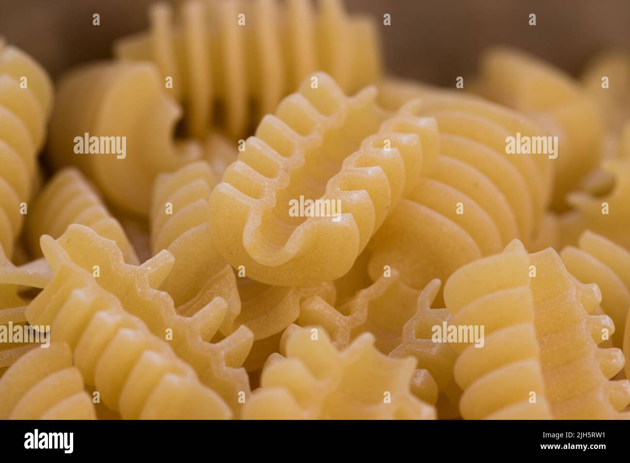 Detail of some radiatori, some pieces of raw Italian pasta whose shape resembles an Italian car radiator Stock Photo