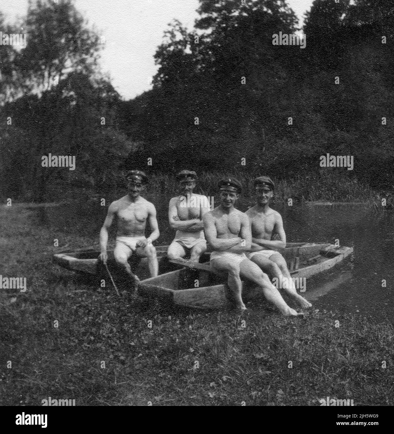 German soldiers naked relaxing on boats during World War One Stock Photo