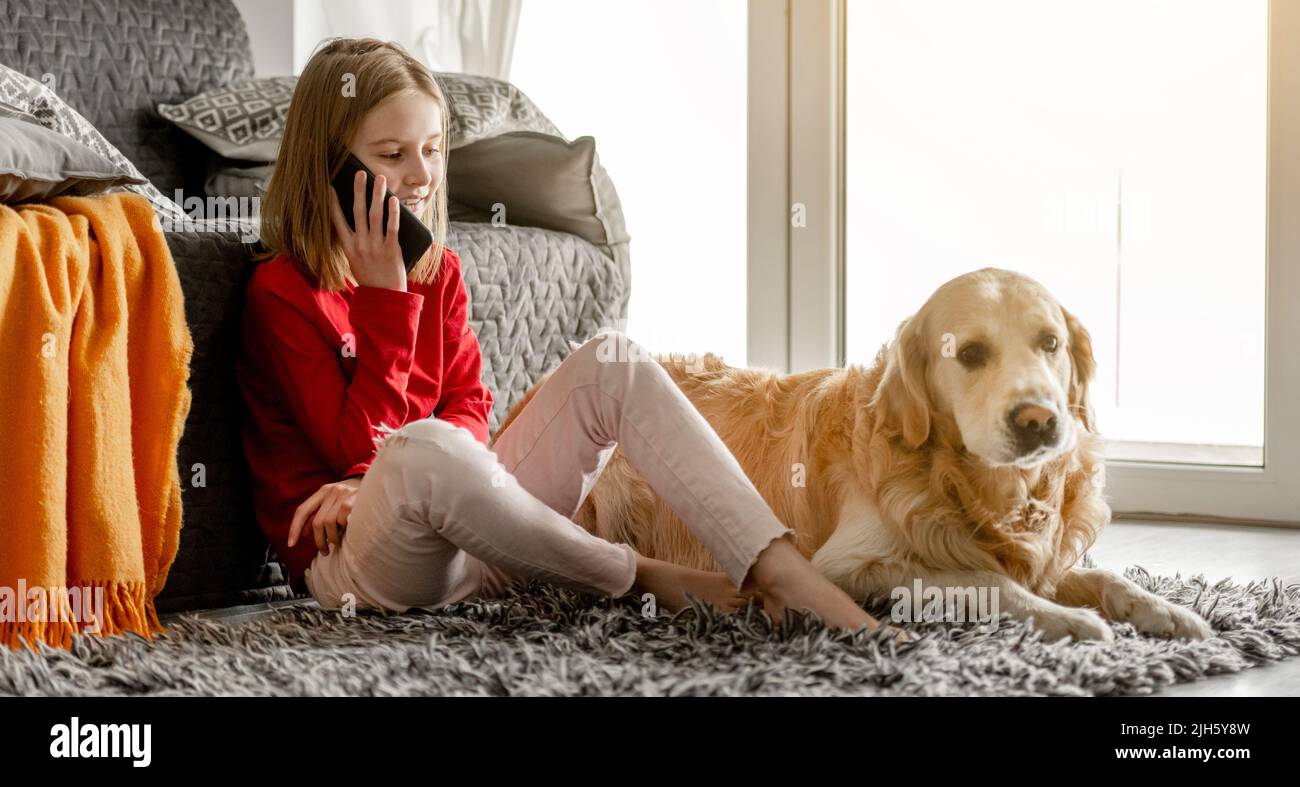 Preteen girl with smartphone Stock Photo