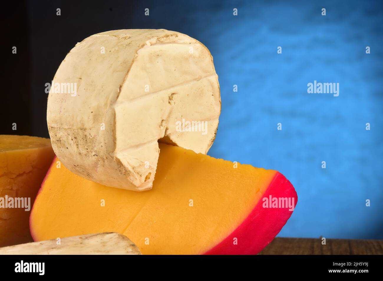 Yellow and brie cheese on studio shot Stock Photo Alamy