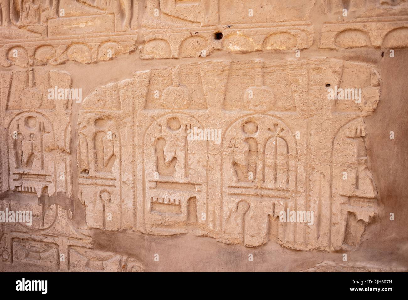 Different hieroglyphs on the walls and columns in the Karnak temple ...