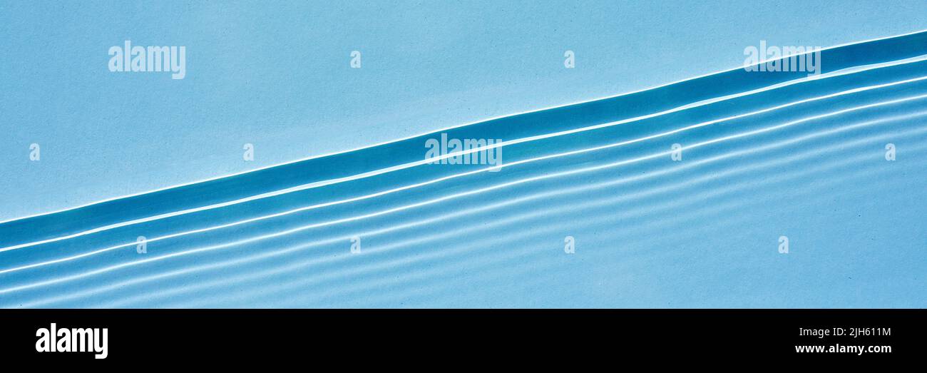 Abstract blue background Horizontal waves, ripples on clear water ...