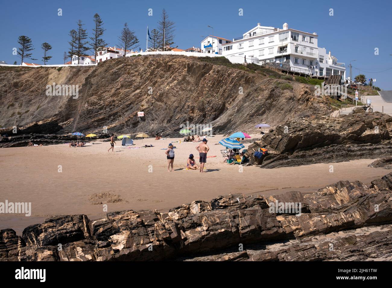 Seaside cliffs and white sand beach in Zambujeira do Mar, Algarve, Portugal Stock Photo