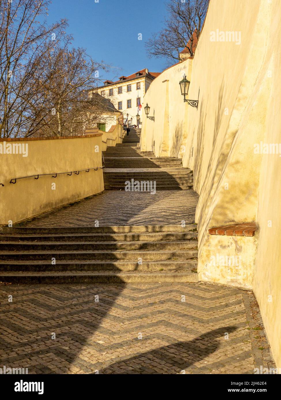 Narrow streets, stairs and wonderful palaces in Prague Castle. A unique sight without a crowd of tourists on a wonderful spring morning. Prague Castle Stock Photo